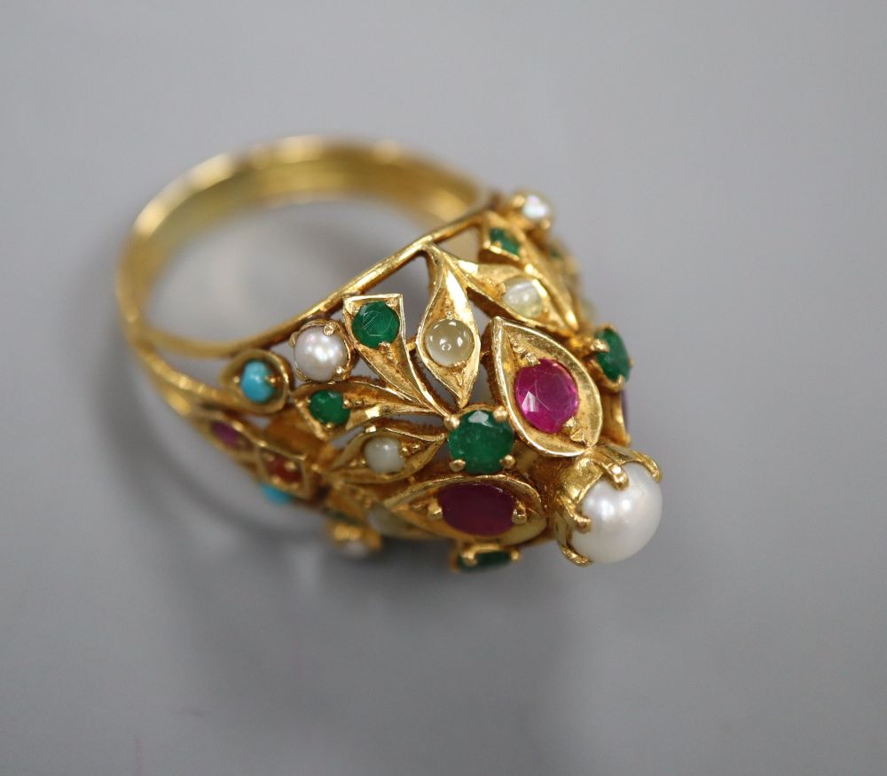 A modern yellow metal and multi gem set cocktail ring, size O/P, gross 11.5 grams.